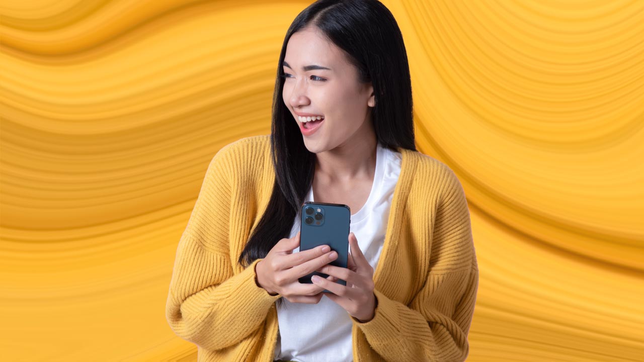 Woman purchasing digital insurance on mobile phone.