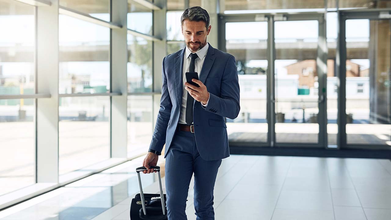 business traveler with cell phone