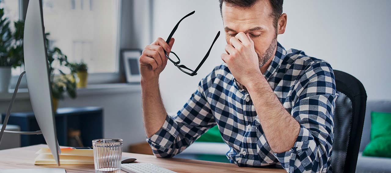 tired man at desk